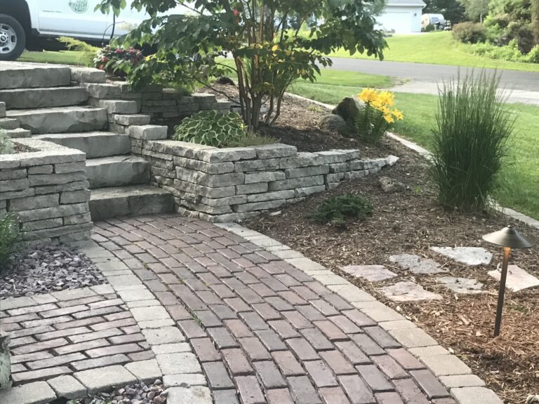 Brick pathway leading to stone garden steps.
